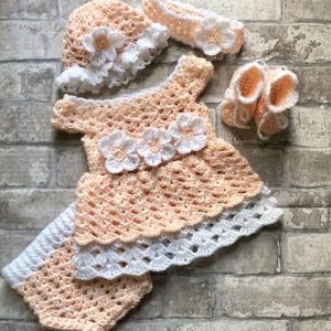 Handmade crocheted baby dress and accessories